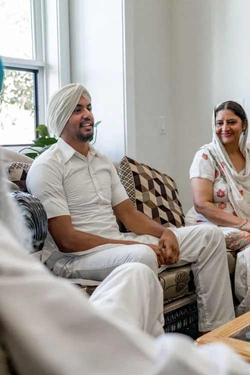 Family members sharing a warm conversation in a bright living room